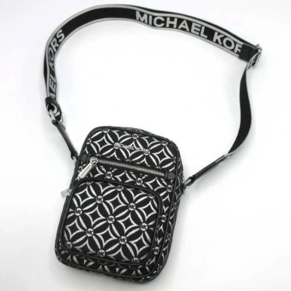 Michael Kors NWT Jet Set black and silver crossbody with guitar strap, NWT